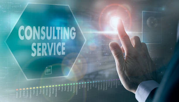 istock A businessman controlling a futuristic display with a Consulting Service concept on it. 1366055559