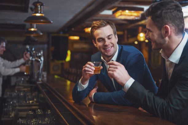 istock Businessmen in pub 1366056244