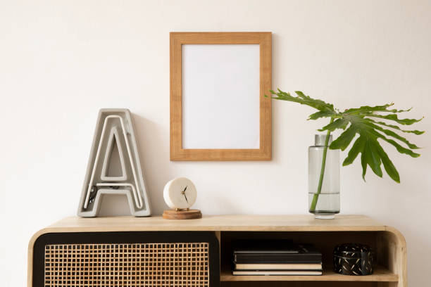 istock Minimalistic interior composition with rattan commode, wooden frame and personal accessories. Copy space. Template. 1366056281
