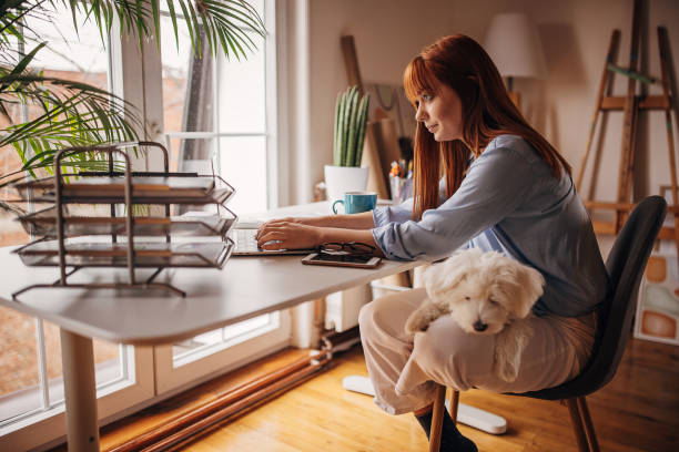 istock Redhead woman working from home 1366057648