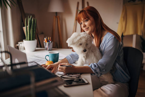 istock Redhead woman working from home 1366057680