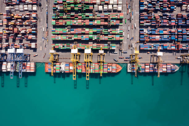 istock Container cargo ship working. Business service import export logistic and transportation of International by container ship in the open sea 1366058015