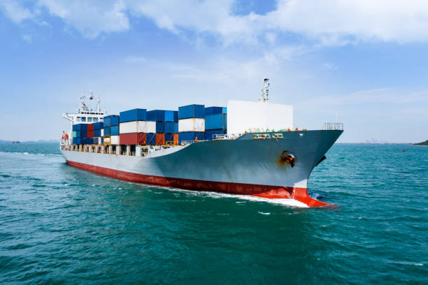 istock angle view in front container ship full speed in green sea, business and industry transportation import export international by container ship open sea 1366058051