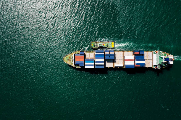 istock container ship sailing on the green sea full speed container for logistics, import export, business and Industry by shipping or transportation Worldwide ocean freight 1366058088