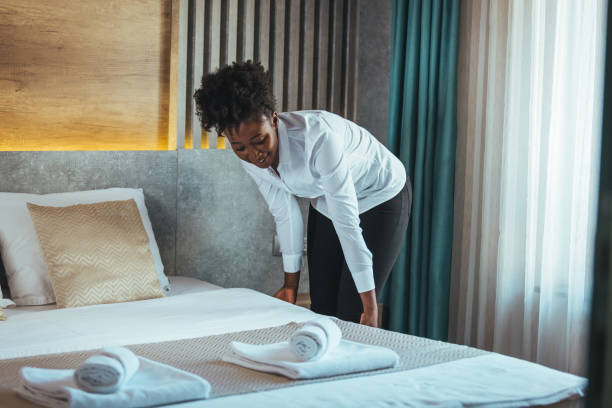 istock Housekeeper cleaning a hotel room. 1366058129