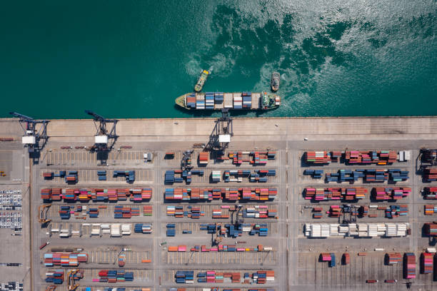 istock Container cargo ship working. Business service import export logistic and transportation of International by container ship in the open sea 1366058138