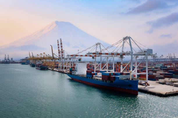 istock Containers ship and shipping ports logistic sea freight load unloading by crane industry and business service shipping import export goods transportation of international by container ship large in ocean water worldwide photograph aerial view from drone 1366058182