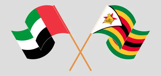 Vector illustration of Crossed and waving flags of the United Arab Emirates and Zimbabwe