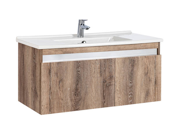 istock White sink with wooden cabinet isolated on white background 1366059497