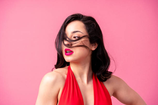 istock Beautiful woman on a pink background 1366059931