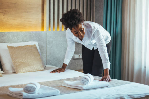 istock Housekeeper cleaning a hotel room. 1366061311