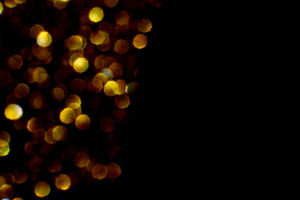 istock Bokeh circle with gold sparkles background. Yellow glitter backdrop. Monochrome 1366061500