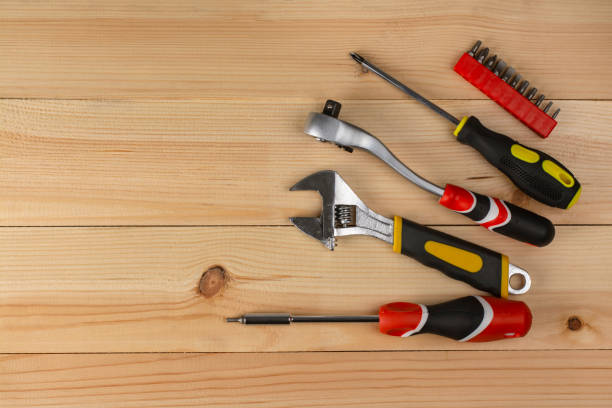istock A set of hand tools on a wooden table. View from above. 1366061565