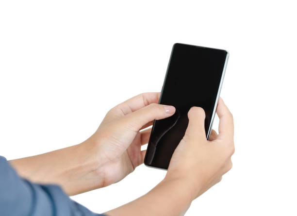 istock Woman hand holding phone on white background 1366062927