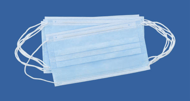 istock Medical protective masks on blue background. 1366062949
