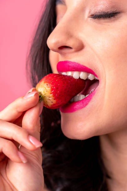 istock Beautiful woman on a pink background 1366063017