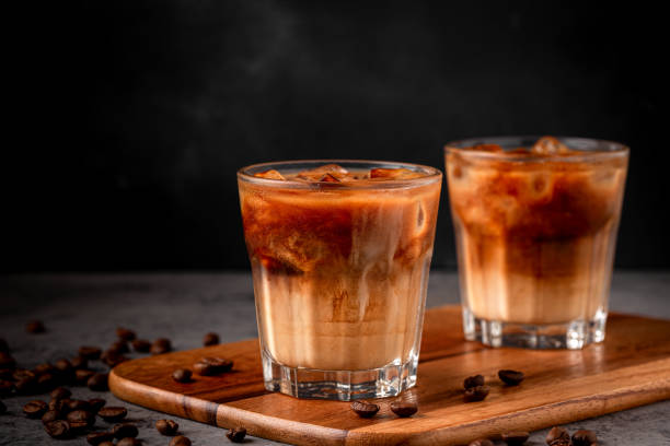 istock Ice coffee in a glass with cream poured over 1366063027