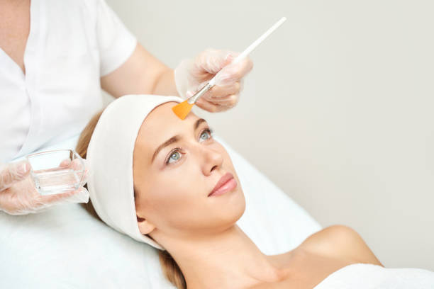 Cosmetology beauty procedure. Young woman skin care. Beautiful female person Cosmetology beauty procedure. Young woman skin care. Beautiful female person. Rejuvenation treatment. Facial chemical peel therapy. Clinical healthcare. Doctor hand. Dermatology cleanser. peel stock pictures, royalty-free photos & images