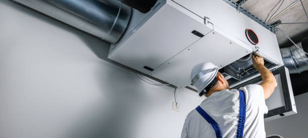 hvac engineer install heat recovery ventilation system for new house. copy space stock photo