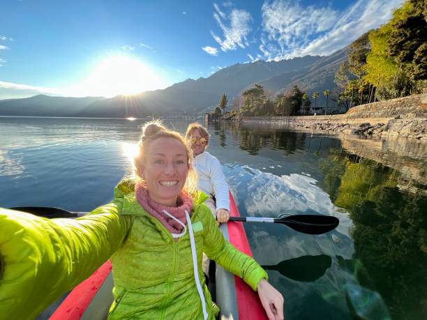 istock Couple taking cool selfie on a canoe trip 1366067706