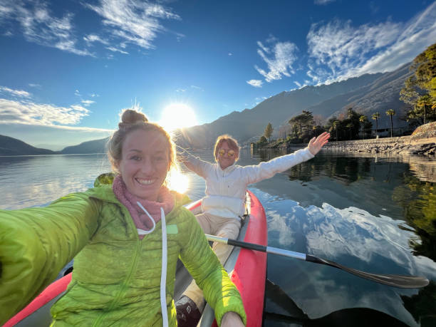 istock Couple taking cool selfie on a canoe trip 1366067749