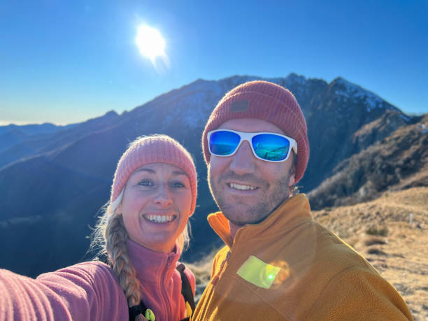 istock Young couple on a hike taking cool selfies in Switzerland 1366068716