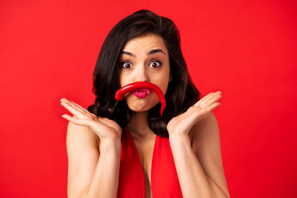 istock Beautiful woman on a red background 1366071447