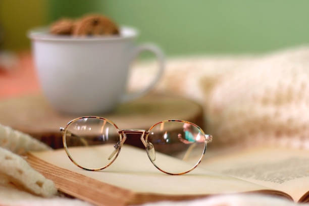 istock Mug with Cookies, Book and Glasses 1366073885