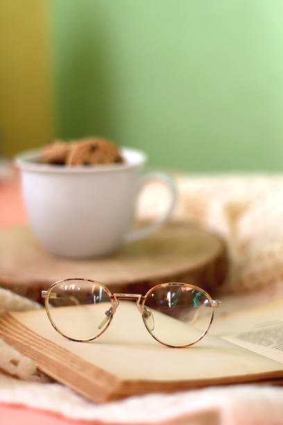 istock Mug with Cookies, Book and Glasses 1366073897
