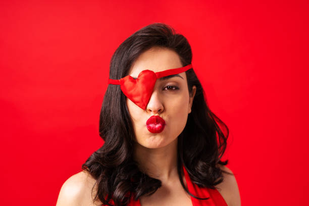 istock Beautiful woman on a red background 1366074379