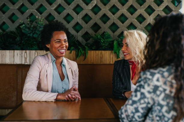 istock Female friends having a great time in cafe 1366074434