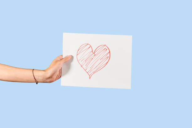 istock Hand holds love concept poster. Isolated. 1366075077