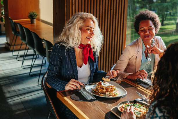 istock Female executives are having discussion during business lunch 1366075093