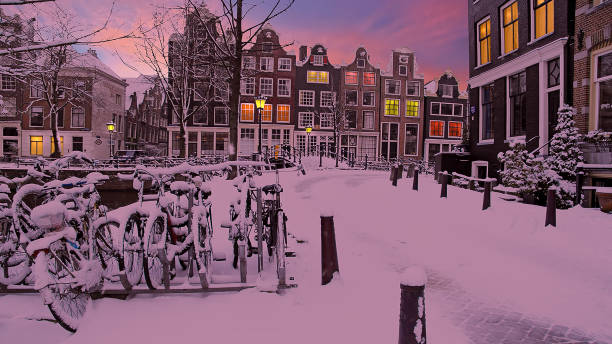 istock Snowy Amsterdam in the Netherlands at sunset 1366077132