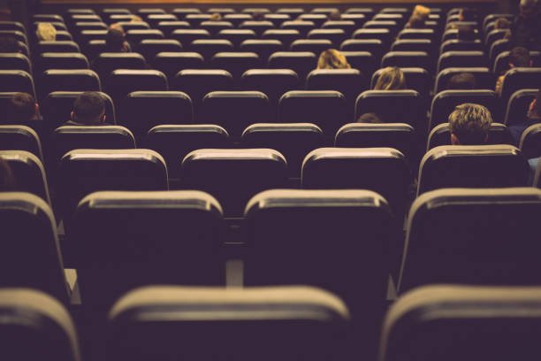 istock Audience on chairs in the concert hall 1366078923