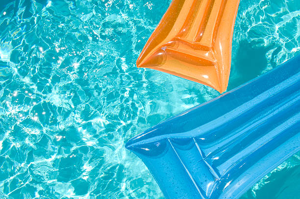 istock Inflatable Air Beds in Swimming Pool 136608261