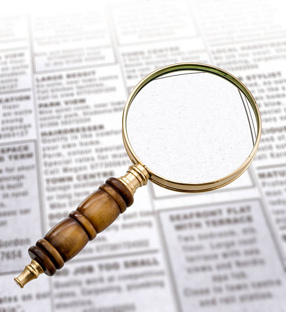 istock Magnifying Glass and newspaper 136608267