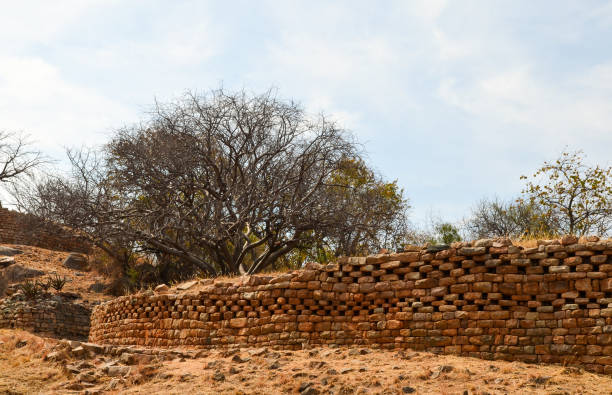istock Curved African dry-stone wall at Khami Ruins, Zimbabwe 1366082980
