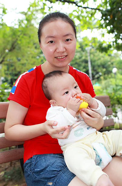 istock Happy Asian mother and son in sunlight 136608633