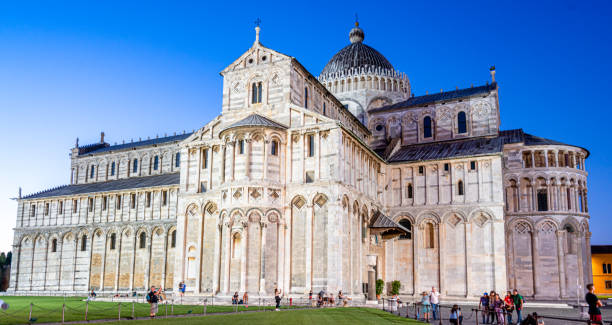 September 13, 2019:  Pisa Cathedral (Italian: Cattedrale Metropolitana Primaziale di Santa Maria Assunta; Duomo di Pisa) is a medieval Roman Catholic cathedral dedicated to the Assumption of the Virgin Mary, in the Piazza dei Miracoli in Pisa, Italy, the oldest of the three structures in the plaza followed by the Pisa Baptistry and the Campanile known as the Leaning Tower of Pisa. The cathedral is a notable example of Romanesque architecture, in particular the style known as Pisan Romanesque.[1] Consecrated in 1118, it is the seat of the Archbishop of Pisa. Construction began in 1063 and was completed in 1092. Additional enlargements and a new facade were built in the 12th century and the roof was replaced after damage from a fire in 1595.