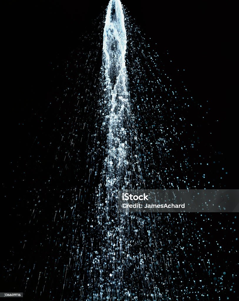 Water shower XXL Water jet flowing in motion on black background high resolution Water Stock Photo