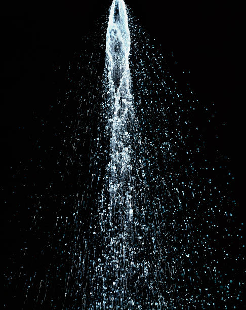 Water shower XXL Water jet flowing in motion on black background high resolution spraying water stock pictures, royalty-free photos & images