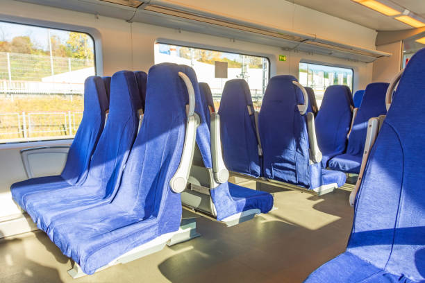 istock Interior of a passenger train with empty blue seats. 1366091828
