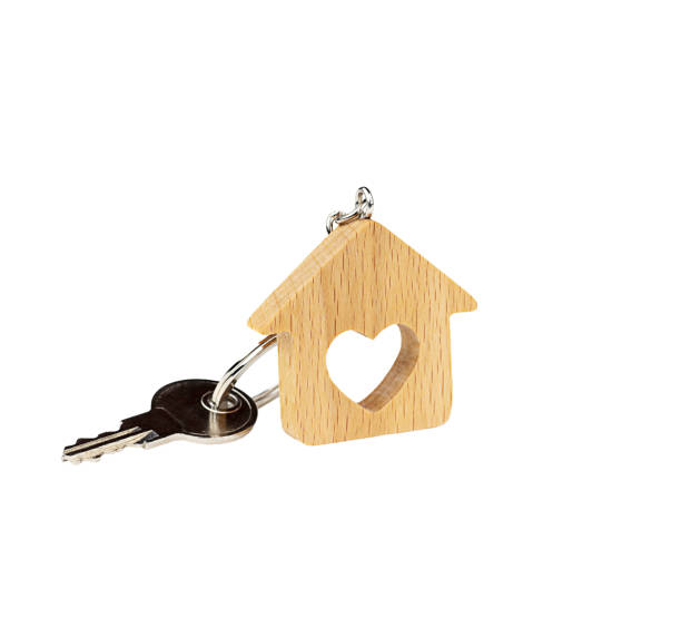 istock Wooden keychain House with Key on white background, Isolate. Home Shopping Concept 1366092009