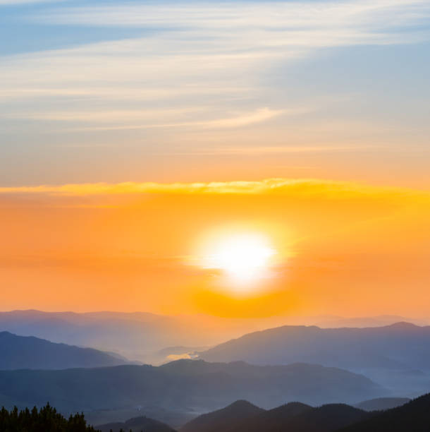 istock mountain chain silhouette in blue mist at the sunset 1366094479