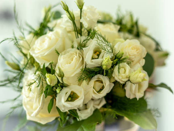 istock A wedding bouquet with white eustomas and roses. 1366097663