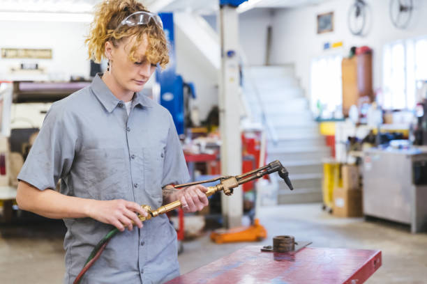 istock Automobile mechanic preparing gas welding torch 1366102618