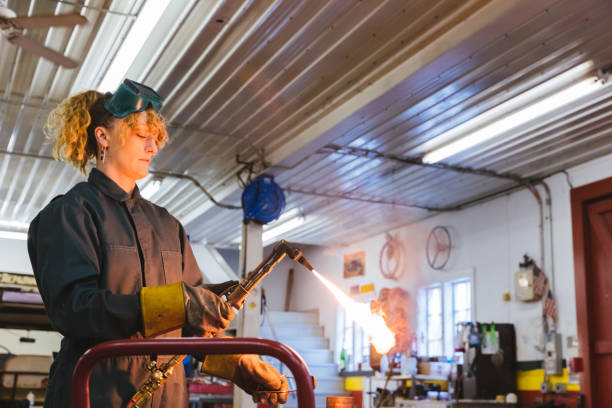 istock Automobile engineer firing up gas welding torch 1366102931