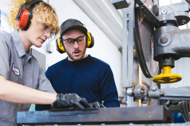 istock Automobile engineers working on a heavy machinery 1366102951