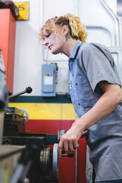 istock Female mechanic working in her garage 1366103002